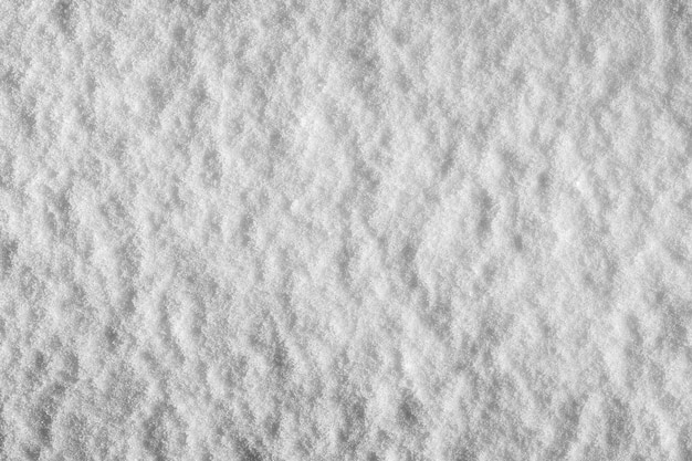 Le motif et la texture de la neige fraîchement tombée La couleur naturelle du fond neigeux