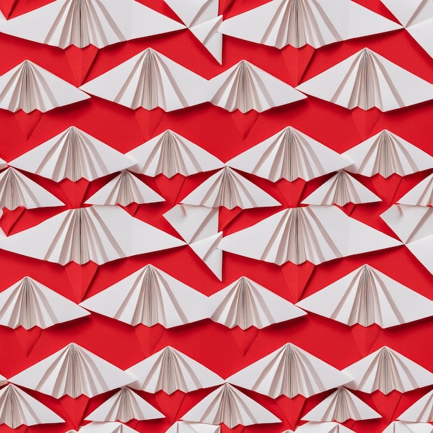 Photo des motifs d'origami abstraits sans couture en papier rouge et blanc brillant