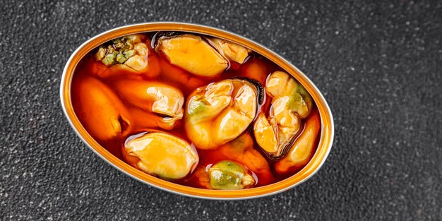 Les moules en conserve, les fruits de mer, les apéritifs, les produits biologiques, les produits frais, les plats gourmets, le fond sur la table, la nourriture rustique, la vue sur le dessus, l'espace de copie, le régime céto, le paléo, le pêcheur, le végétarien.