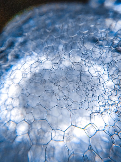 Mousse de savon mousse bleue bulle texture légère motif de fond photo macro