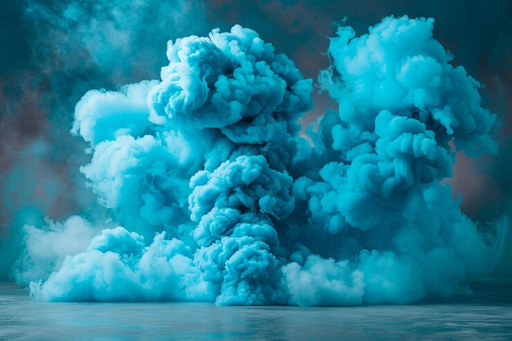 Photo le mouvement de la fumée turquoise s'étend sur un fond noir