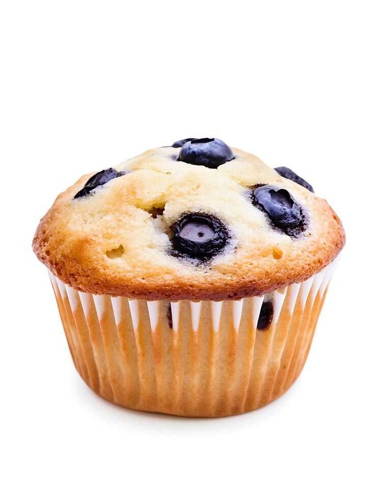 Photo un muffin avec des bleuets et des bleuettes sur le dessus