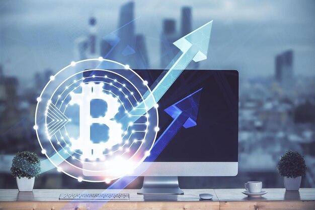Multi exposition de l'hologramme du thème blockchain et du tableau avec l'arrière-plan de l'ordinateur Concept de la crypto-monnaie bitcoin