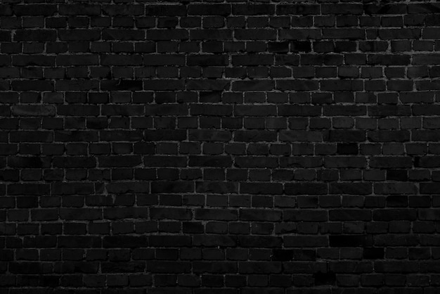 Photo mur de bâtiment en brique noire