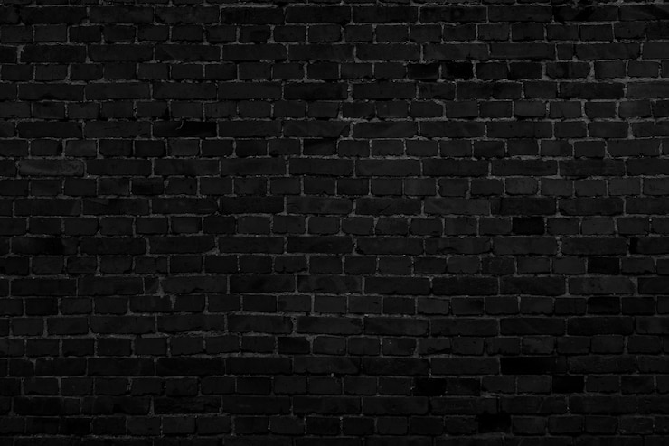 Photo mur de bâtiment en brique noire