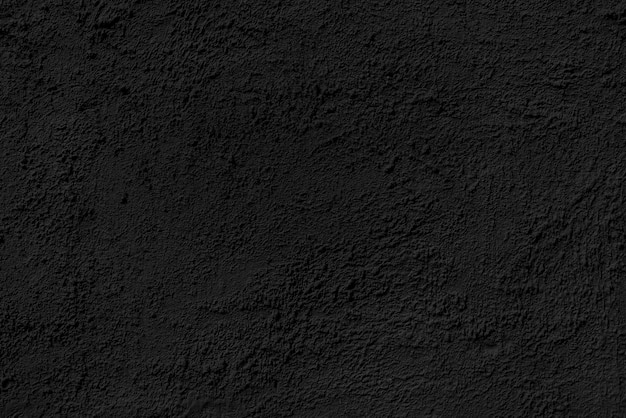 Mur de bâtiment plâtré abstrait texture noire rugueuse