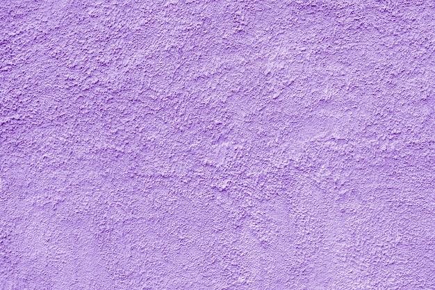 Mur de bâtiment plâtré abstrait texture violette rugueuse