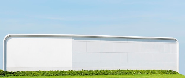 Mur de béton blanc avec mur de brousse sur fond de ciel bleu