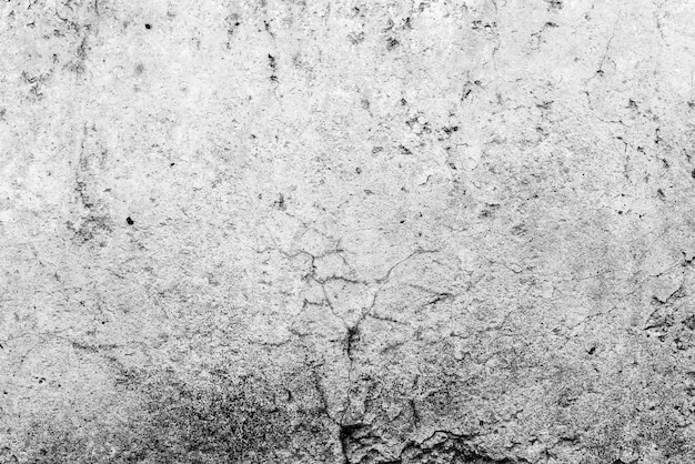 Photo mur de béton fissuré et rayé