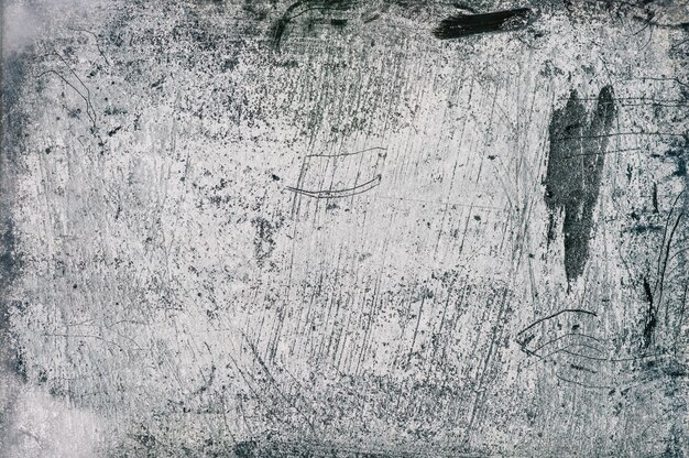 Le mur de béton gris, bleu et blanc avec motif et lignes en relief en plâtre