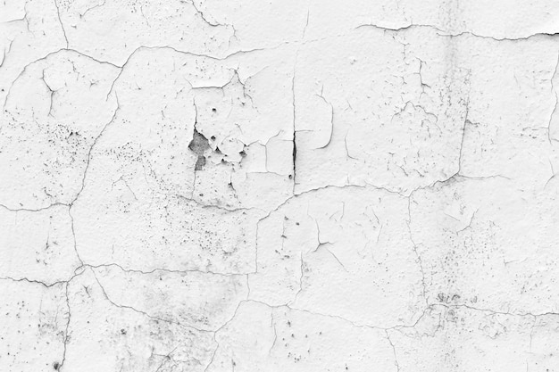 Mur blanc avec fond de fissures