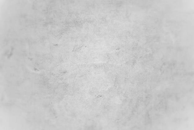 Un mur blanc avec un fond gris et une surface texturée blanche.