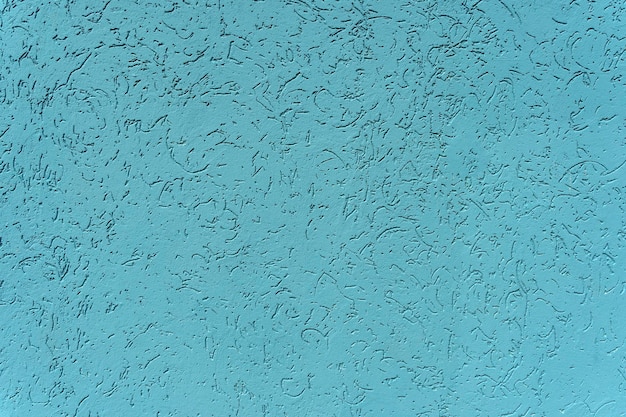 Mur bleu avec fond de plâtre Texture de surface de grain de plâtre et de mastic Concept de décoration de finition