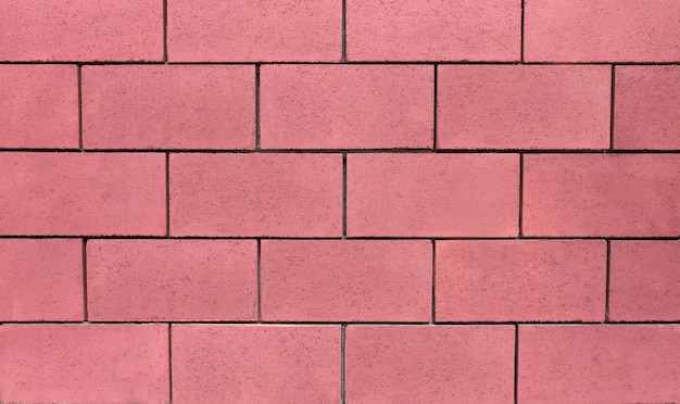 Mur de blocs de béton en rose, arrière-plan