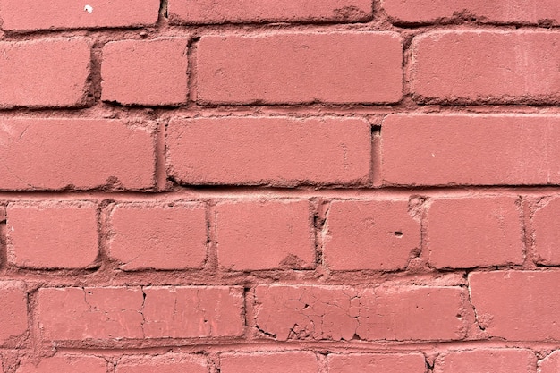 Un mur de brique rouge inégal bâclé Contexte pour la conception