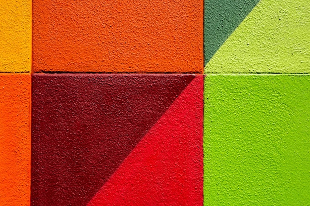 Mur de brique rouge et jaune vert coloré comme texture de fond