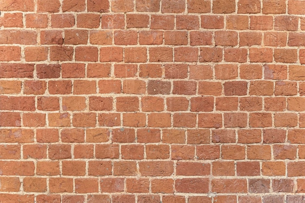 Mur de briques anciennes maçonnerie d'une vieille brique dans un style rustique la structure et le motif de la destro...