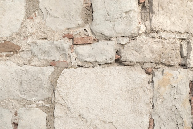 Mur de briques anciennes de texture de briques grises anciennes