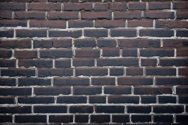 Un mur de briques avec des briques noires et blanches.