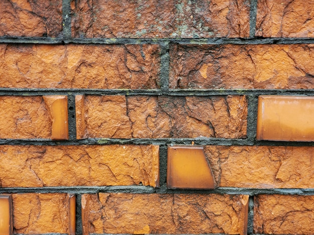 Mur de briques brunes grises de fond de texture