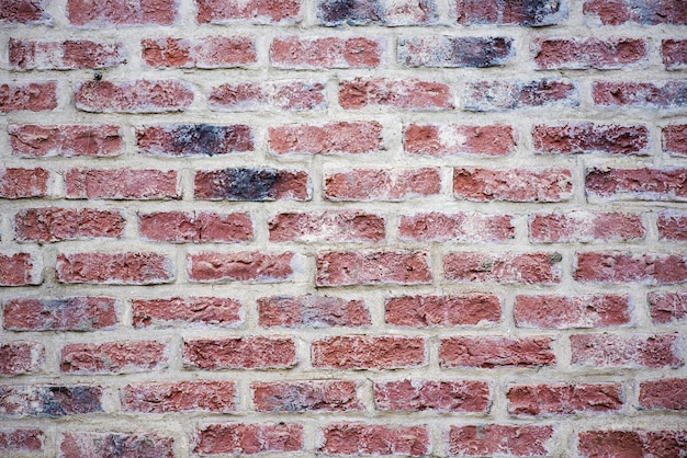 Mur de briques brunes, maçonnerie, surface de la pierre comme toile de fond