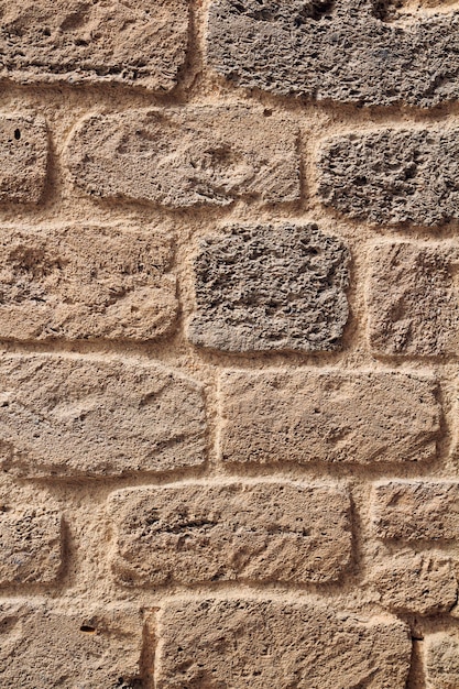 Mur de briques de coquine jaune. mur de briques de roche