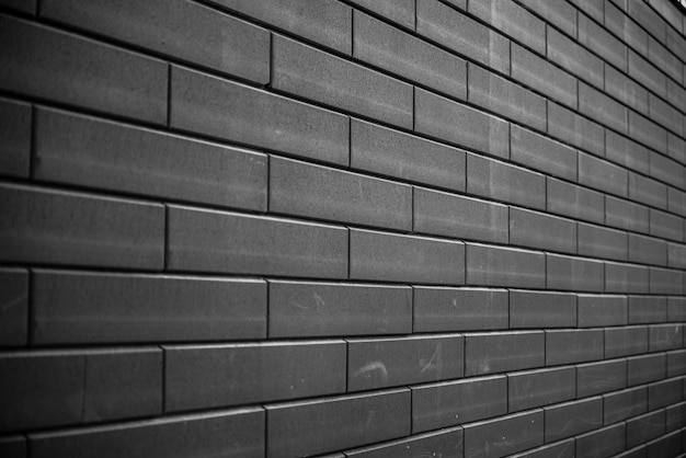 Mur de briques noires. Fond de maçonnerie de texture de mur de brique noire urbaine.