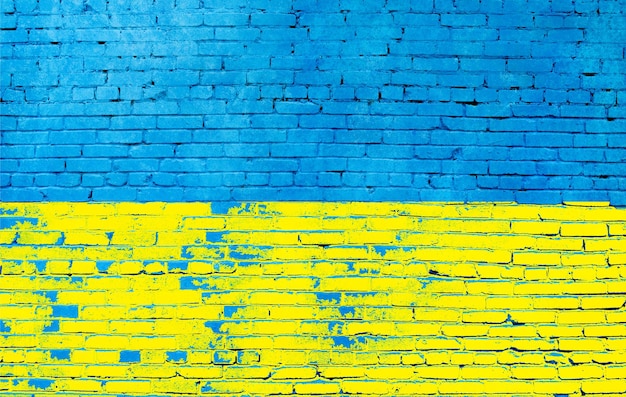 Mur de briques peint aux couleurs du drapeau ukrainien en gros plan