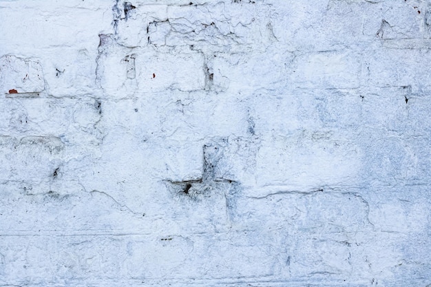 Mur de briques peint fond blanc ou texture