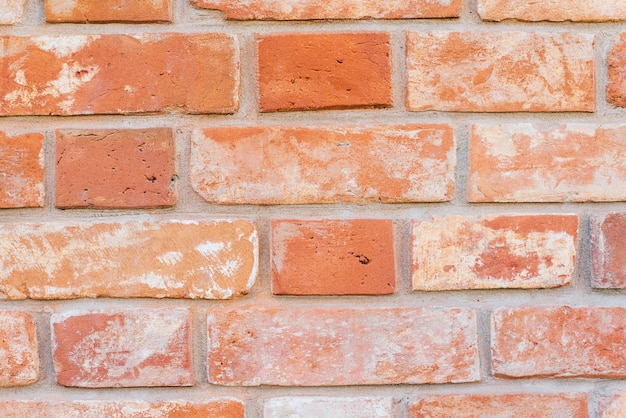 mur de briques rouges frottées. Beau fond de brique.