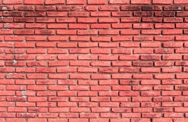 Mur en briques rouges pour le fond et la conception de la construction