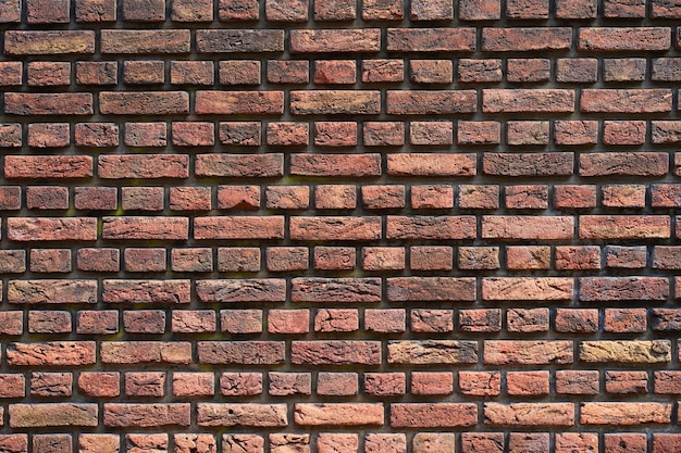 Mur de briques rouges pour le fond ou la texture. Vieux fond de texture de mur de brique rouge