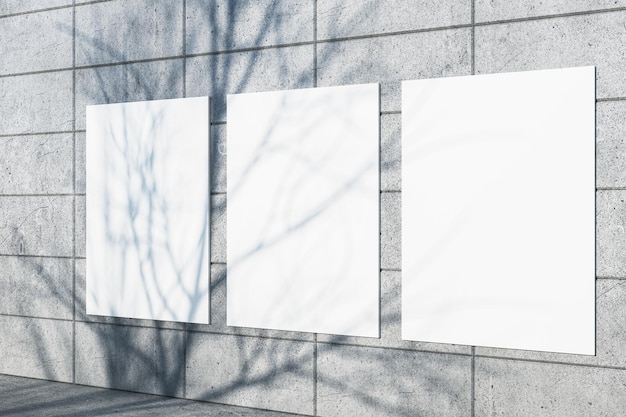 Mur de carreaux extérieur créatif avec l'ombre d'arbres et des posters de mock-up blancs Concept de conception urbaine Rendering 3D