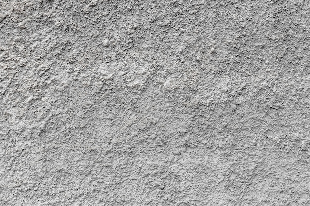 Mur de ciment en béton grunge avec fissure dans un bâtiment industriel