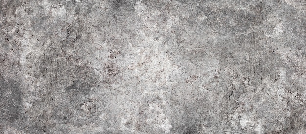 Mur de ciment à rayons grunge ou texture de surface en béton pour le fond.