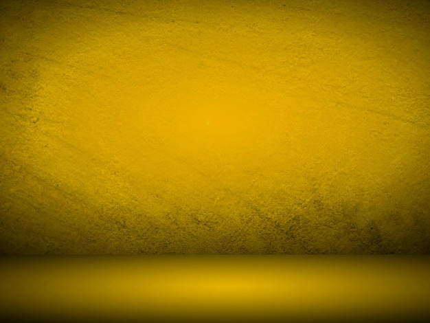 Mur dégradé jaune. salle de studio vide. fond de studio uni