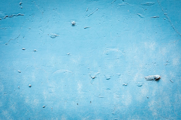 Mur fissuré peint en bleu - fond - motif.