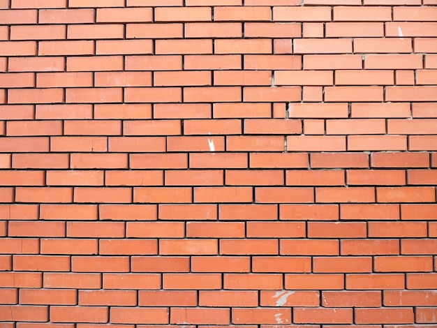 Mur de fond de briques lisses brunes.