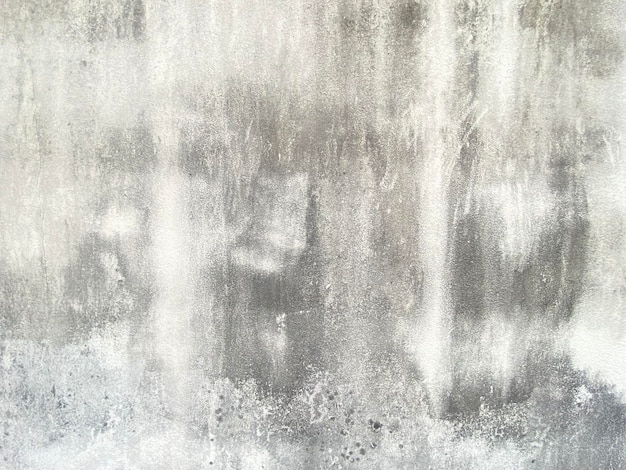 Un mur gris avec un fond texturé blanc