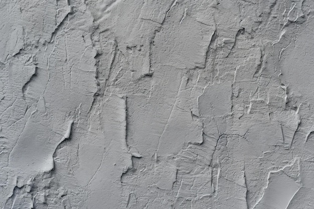 Un mur gris avec des lignes et des lignes rugueuses.