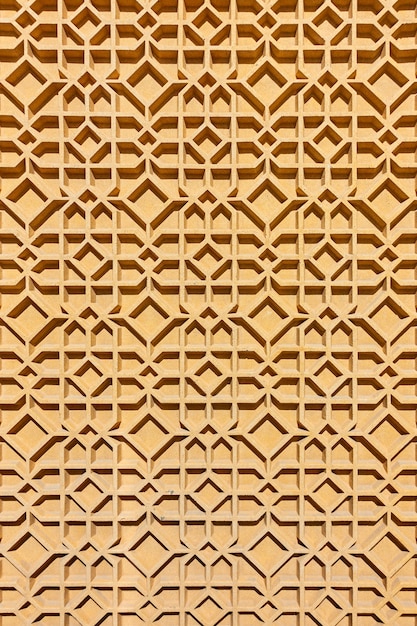 Mur avec motif arabe géométrique. Détail ornemental architectural