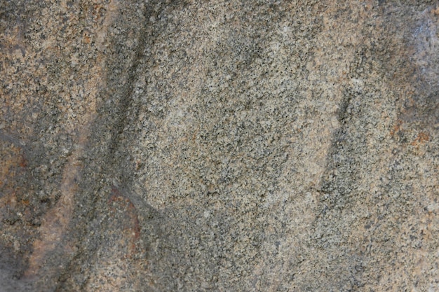 Mur de pierre brune rugueuse Texture de roche naturelle Vue rapprochée de la surface texturée altérée