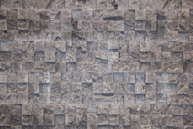 Le mur de pierre naturelle non traitée Pierre décorative Fond de pierre noire