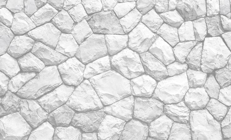 Photo mur en pierre en relief blanc et noir blanc gris clair pour un fond abstrait et une texture pour la conception intérieure ou extérieure des motifs beaux espace pour le travail papier peint bannière de près