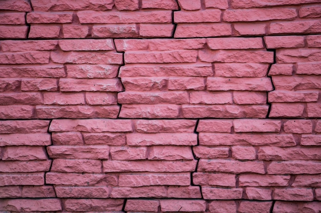 Mur de pierre rose, façade de maison