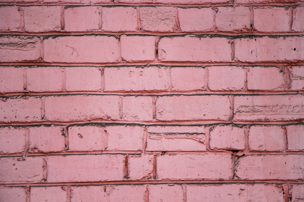 Mur en pierre rose, façade de maison