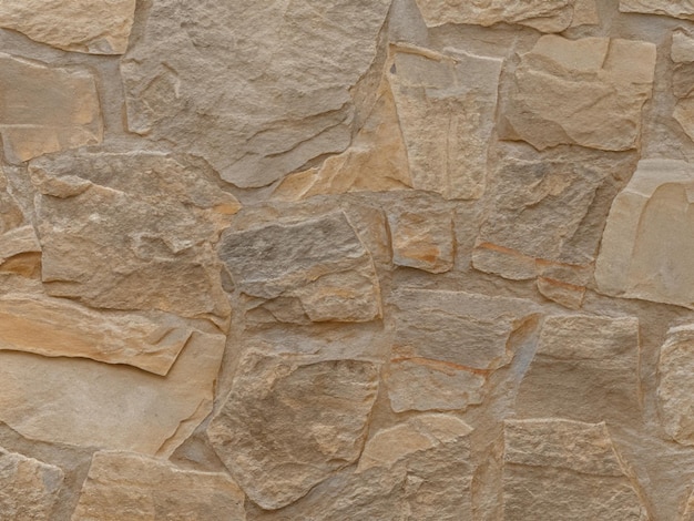 Photo mur en pierre texture rocheuse brun clair fond grunge en pierre fond rocheux