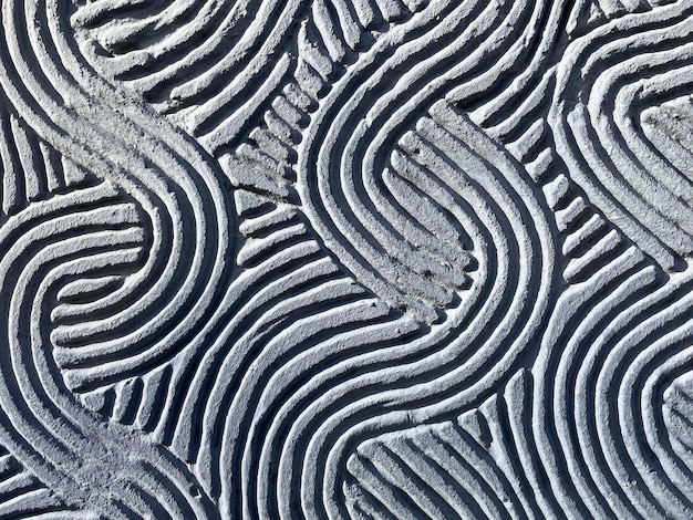 Mur de plâtre bleu avec motif de vagues