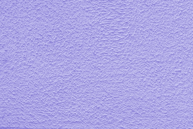 Mur de plâtre violet d'un bâtiment Texture de surface rugueuse