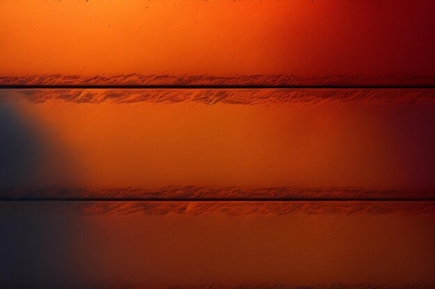 Un mur rouge et orange le matin.